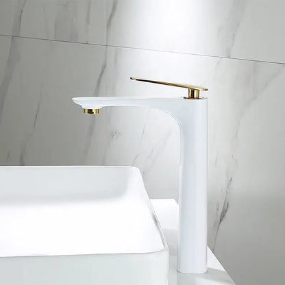 Modern black and gold basin faucet with sleek white ceramic body and polished gold accents decorbites black design