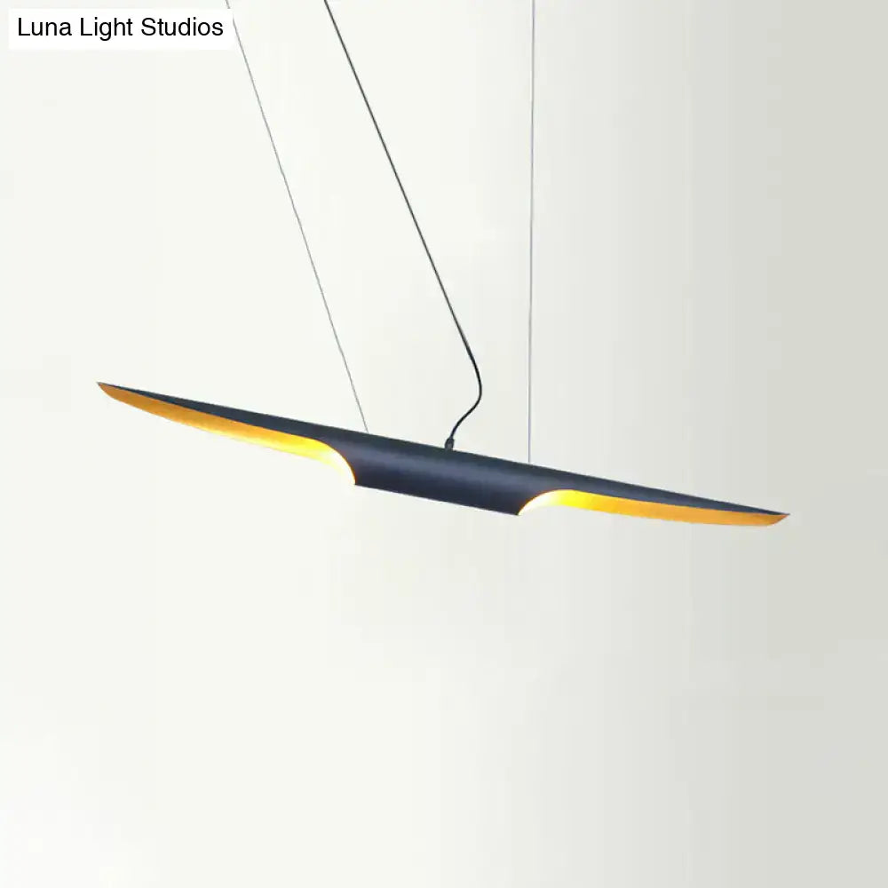 Decorbites modern island pendant lamp with bias cut tube design featuring matte black body and warm gold lining