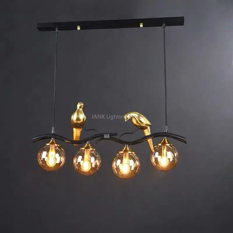 Modern black and gold bird glass pendant lights with amber globe bulbs for dining room lighting