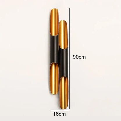 Modern black and gold blade pendant light featuring a sleek cylindrical gold and black metallic wall sconce decorbites coltrane pendant