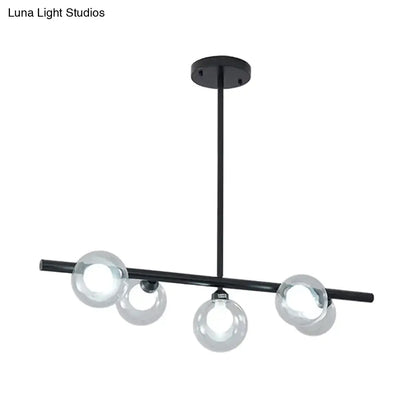 Modern black metal chandelier with gold accents featuring bubble clear glass globe bulbs for clear glass island lighting