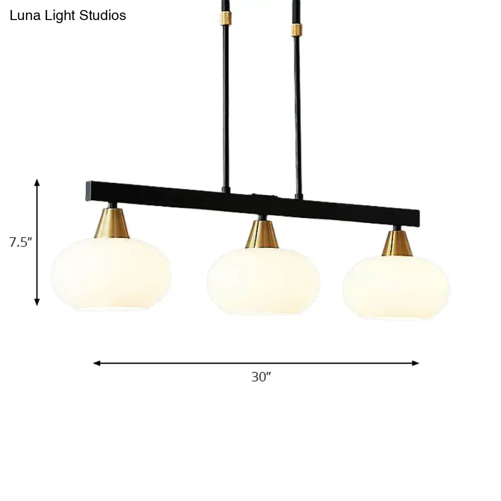 Decorbites™ black modern chandelier with three frosted white oval glass shades and brass accents 220v-240v fixture height