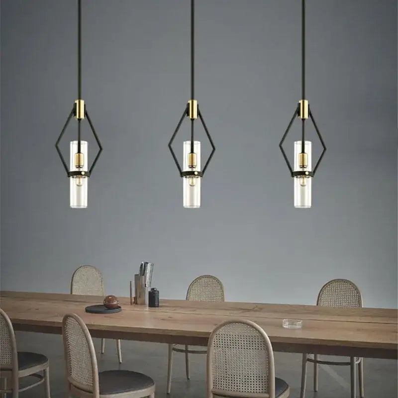 Three modern black and gold pendant lights with clear glass e27 bulbs perfect for dining room decorbites clear glass lighting