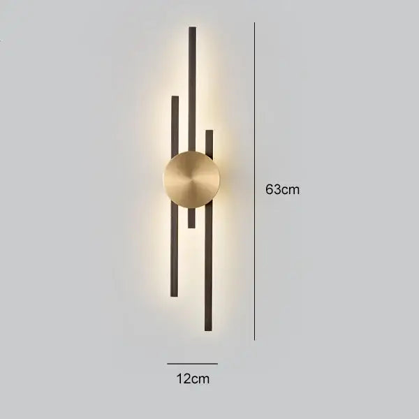 Modern black and gold copper wall light with brushed brass center and matte bars emitting warm ambient light for bedroom decorbites copper wall