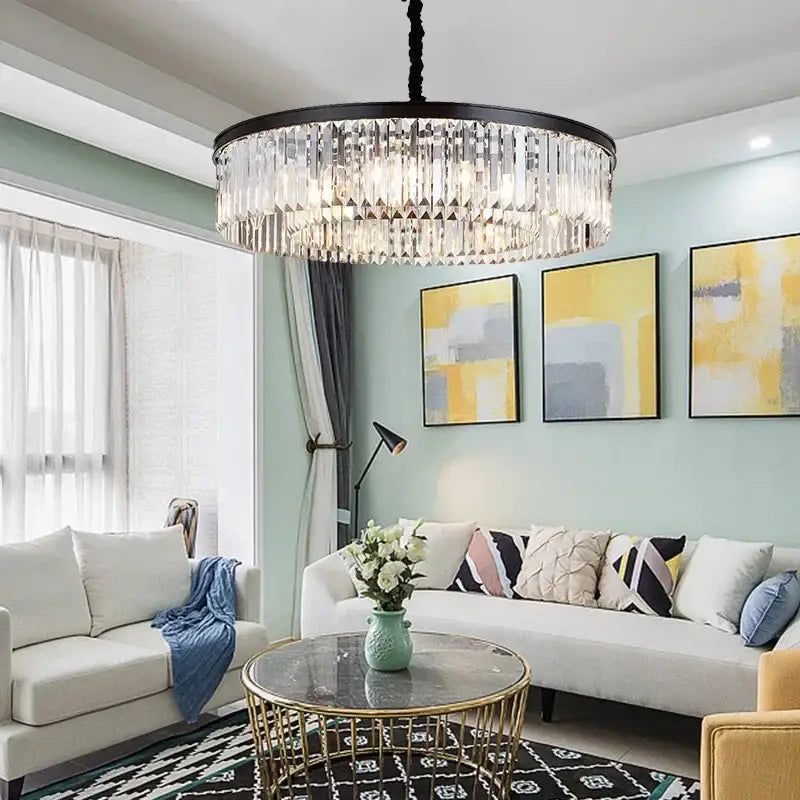 Modern black and gold crystal pendant light with metal finish and cascading clear glass prisms on chain pendant