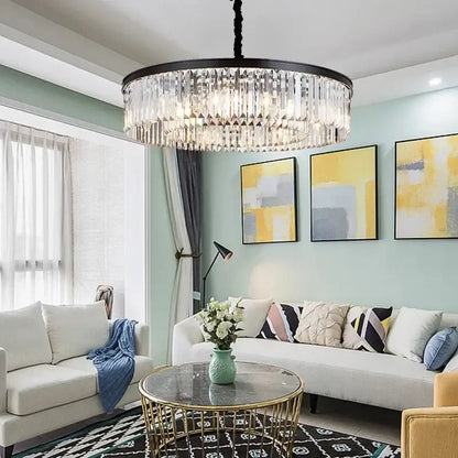 Modern black and gold crystal pendant light with metal finish and cascading clear glass prisms on chain pendant