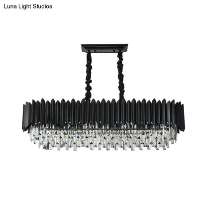Modern black and gold rectangular chandelier with faceted crystal droplets and twisted black metal chains for dining room use