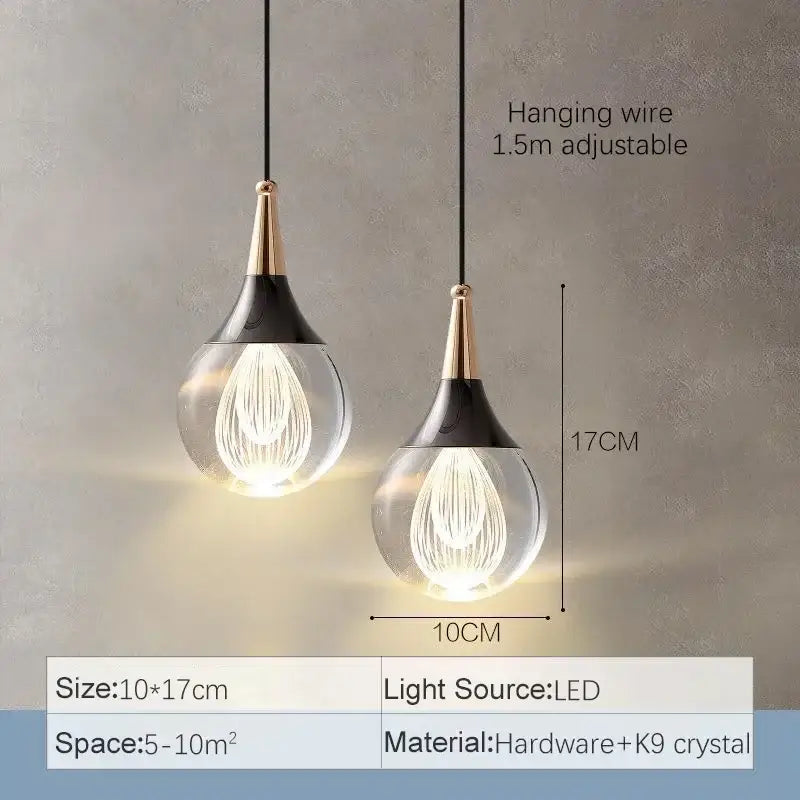 Modern black and gold crystal led teardrop pendant light with clear glass globe and brass accents for dining room decorbites crystal led