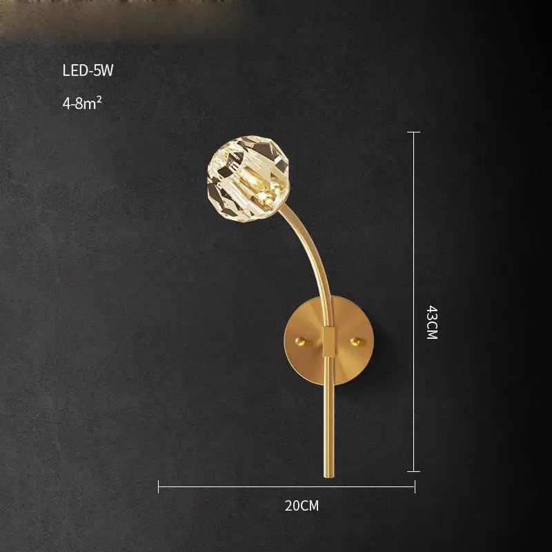 Modern black and gold crystal led wall sconce with gold-toned curved arm and faceted crystal globe for bedroom decorbites crystal led