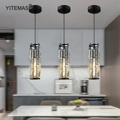 Three black-framed crystal mini pendant lights with cascading rods in a decorbites mini pendant chandelier for kitchen lighting