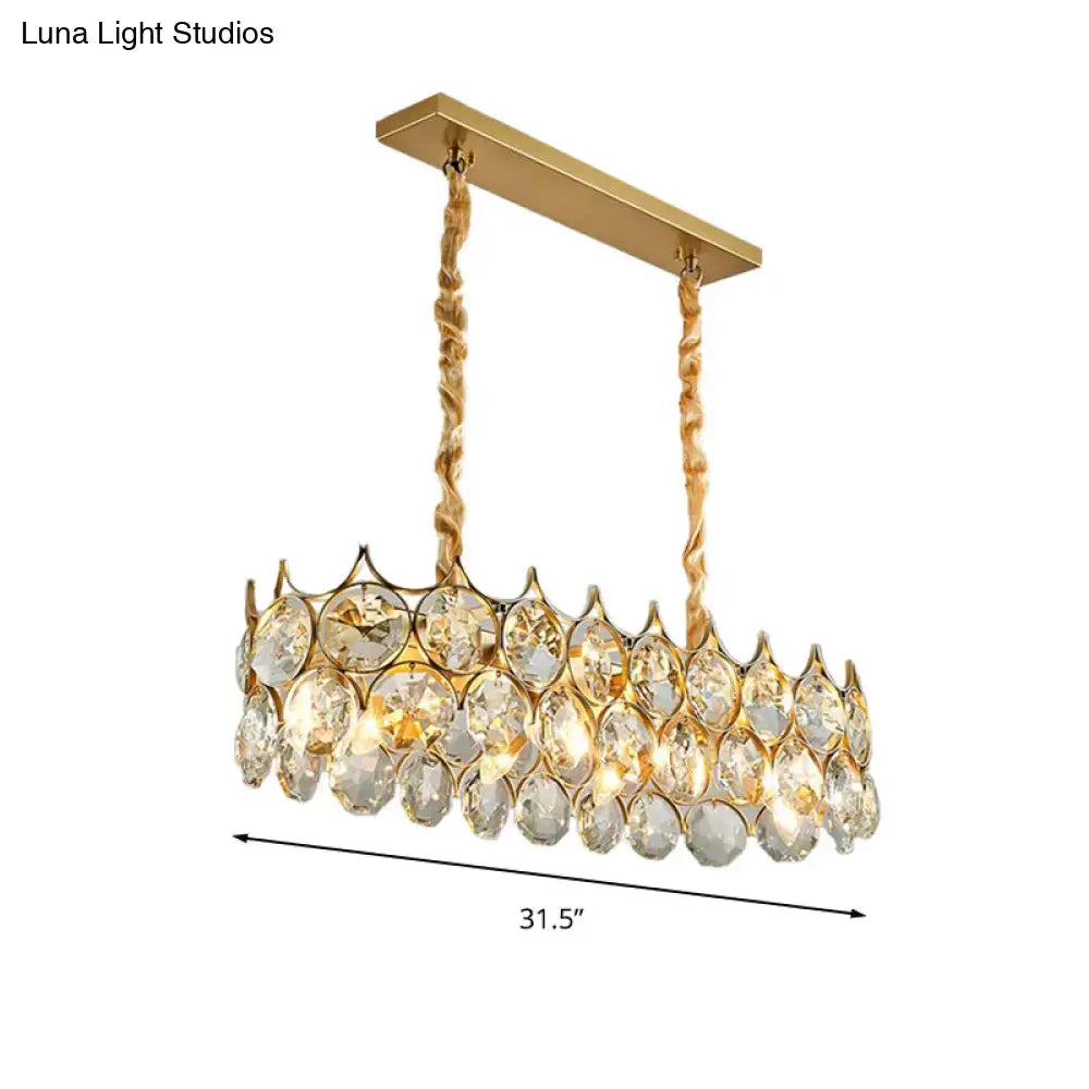 Modern black and gold pendant lighting fixture with crystal prism shade and gold-toned chandelier for dining room use