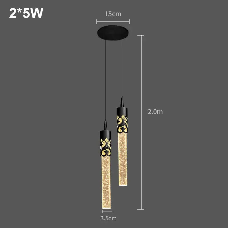 Modern black and gold crystal rod pendant light with two glowing textured glass cylinders for dining room use