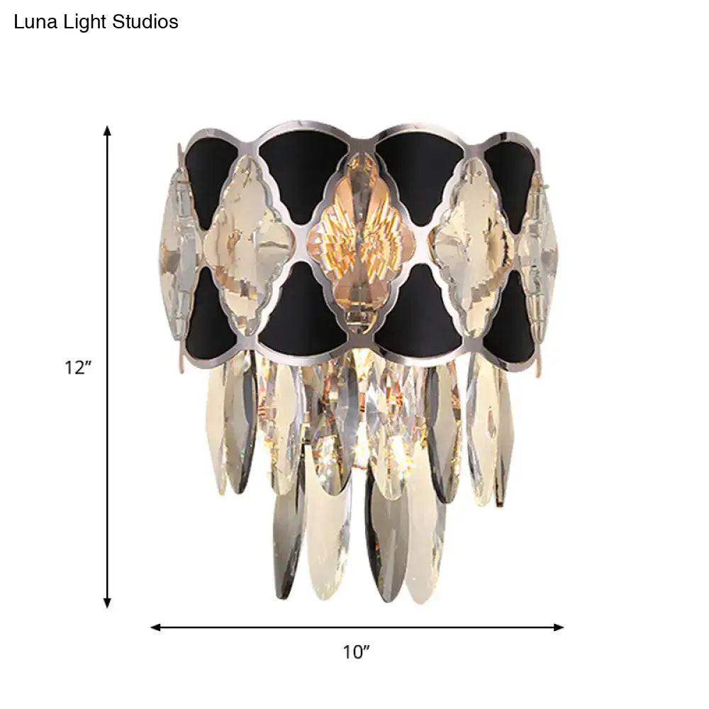 Modern black and clear crystal wall lamp fixture with central golden winged design for living room sconce lighting
