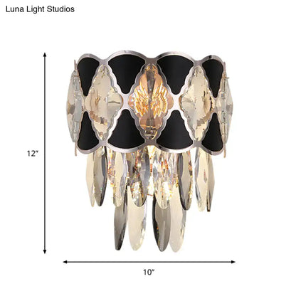 Modern black and clear crystal wall lamp fixture with central golden winged design for living room sconce lighting