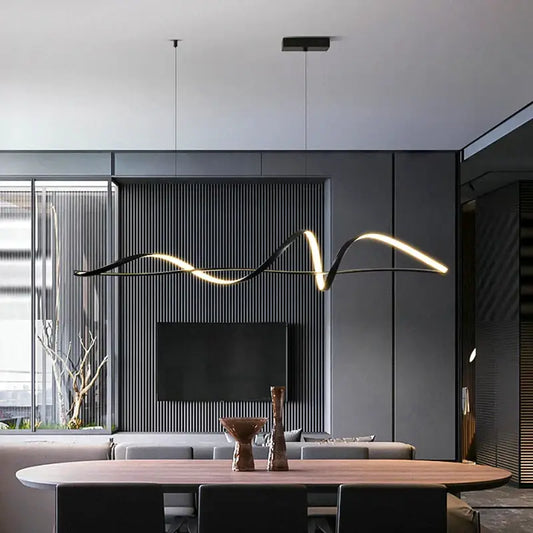 Modern black and gold curved pendant light with sleek design and dimmable versions above dining table highlighting color temperature