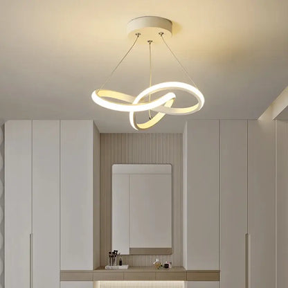 Modern black and gold decorbites contemporary chandelier featuring a white led intertwined circular rings design for dining rooms