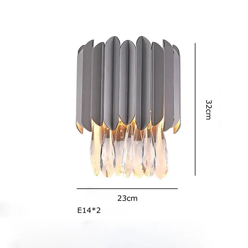Modern gray metallic wall sconce with cascading crystal droplets complementing decorbites crystal ceiling chandeliers
