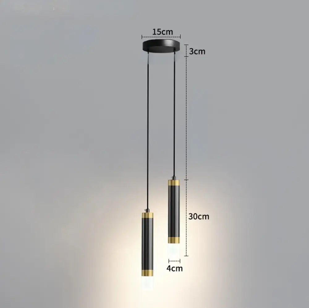 Modern black and gold cylindrical pendant light with minimalist design for kitchen spaces of five square meters