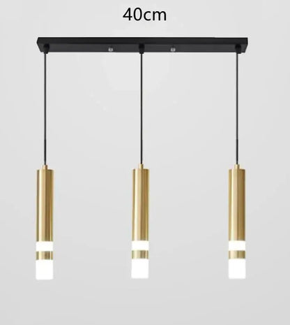 Modern black and gold pendant light with three cylindrical fixtures and frosted diffusers for 5 square meters kitchen