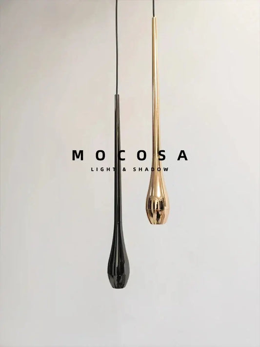 Two sleek black and gold metallic finish pendant lights with remote control hang against a minimalist white background