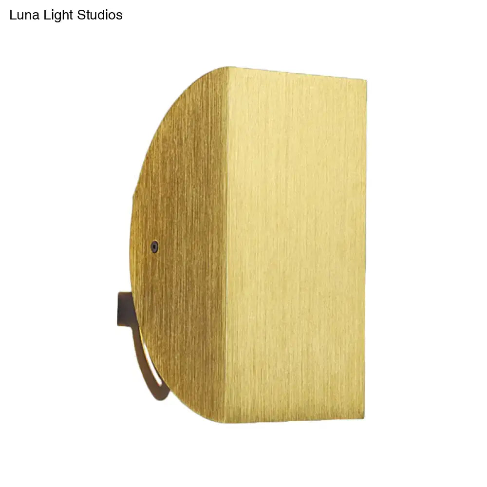 Brass-finished modern black and gold folded wall light sconce with sleek half-circular brushed metal texture for bedroom decor