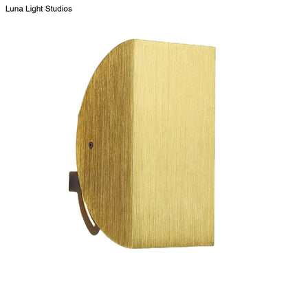 Brass-finished modern black and gold folded wall light sconce with sleek half-circular brushed metal texture for bedroom decor