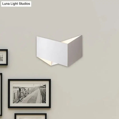 Modern white geometric wall lamp with metal body featuring a clean angular design ideal for stairway lighting