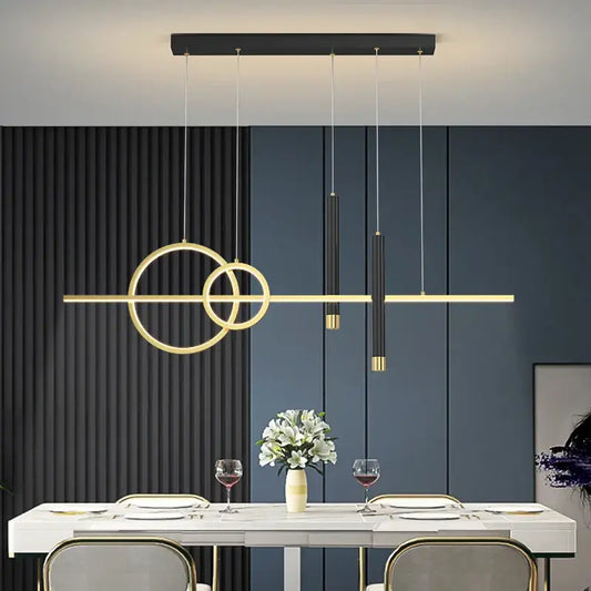 Modern black and gold geometric pendant light with metal construction featuring intersecting rings for dining room