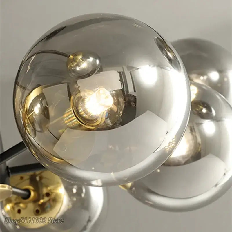 Modern black and gold decorbites glass ball led chandelier with spherical glass globe and exposed filament bulb