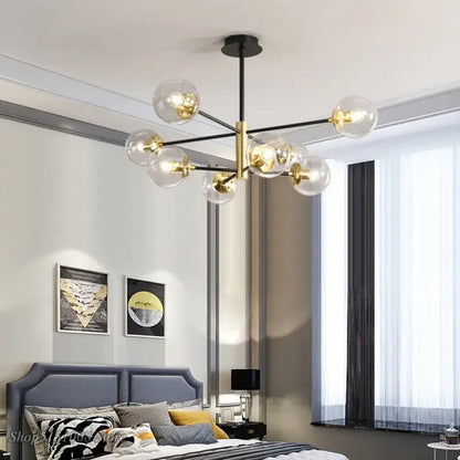 Modern black and gold glass ball led chandelier featuring clear glass globe bulbs for elegant living room decorbites lighting