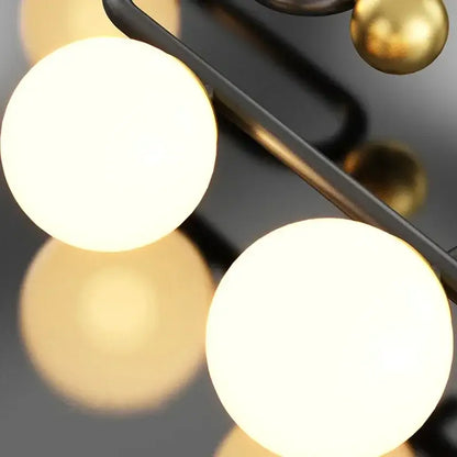 Modern black and gold chandelier pendant with frosted glass ball led shades and polished brass accents for dining room decorbites