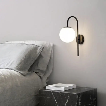 Modern black curved wall sconce with frosted glass globe for bedroom decorbites glass ball led wall lighting