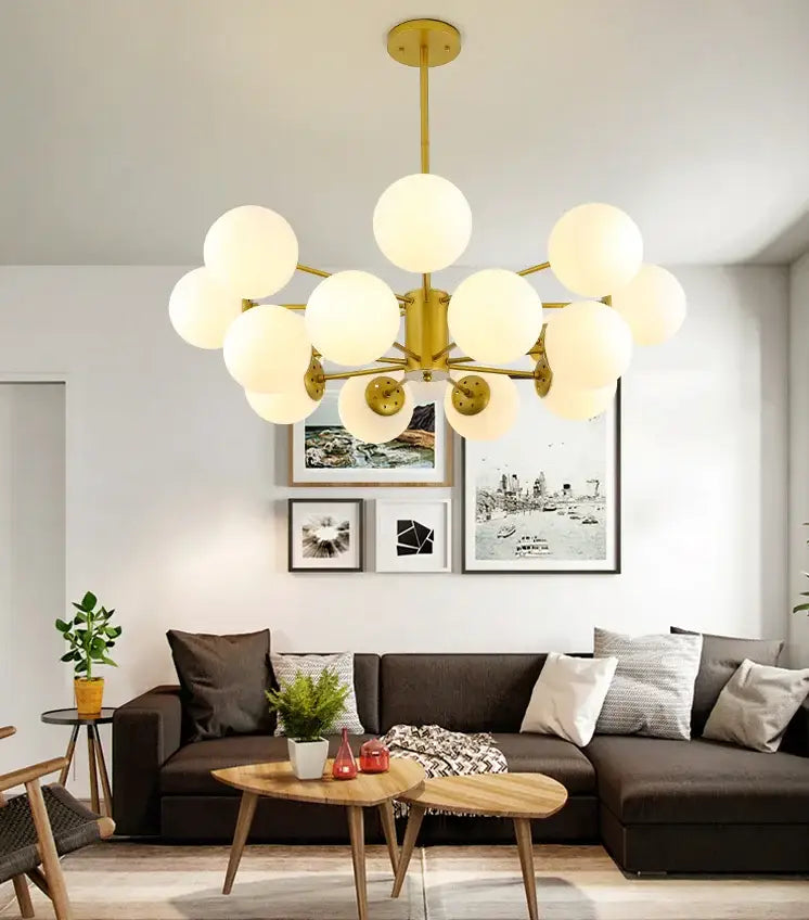 Modern black gold glass pendant light with gold-toned frame and frosted globe bulbs for living room decorbites black gold