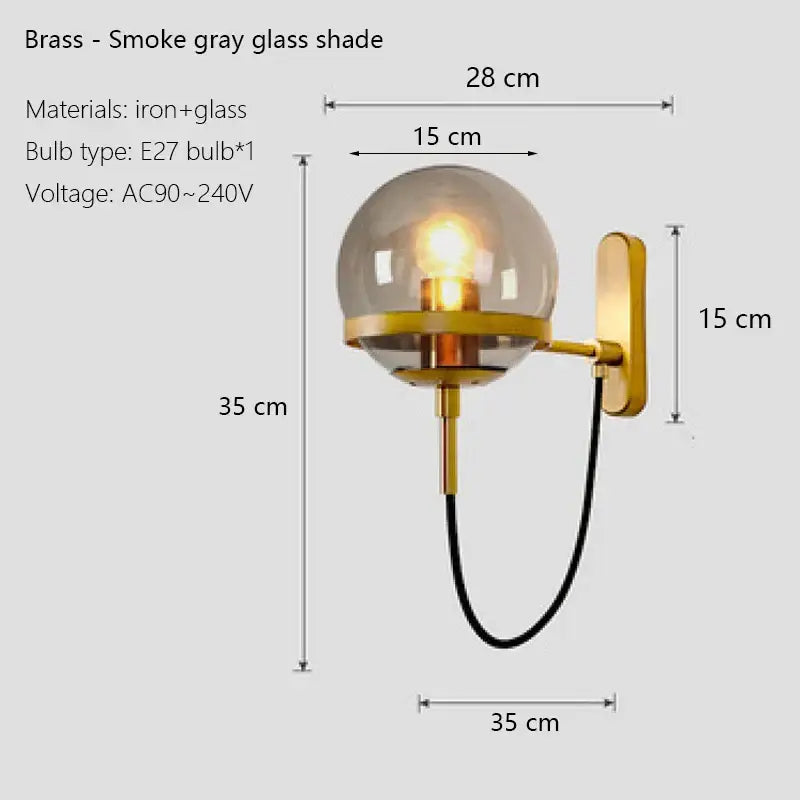 Modern black and gold wall sconce lamps with brass base and smoked gray glass globe shade for bedroom lighting