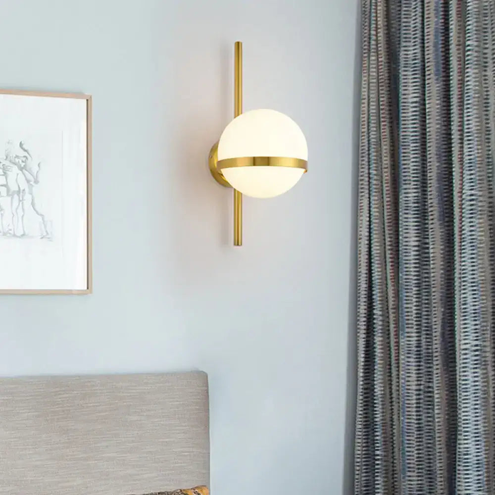Modern black gold wall sconce with a frosted glass shade and sleek vertical rod for bedroom e26 e27 light type