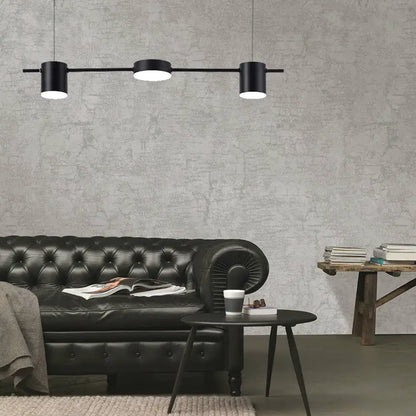 Modern black gold ceiling light fixture with three black cylindrical pendant bulbs on a sleek horizontal bar