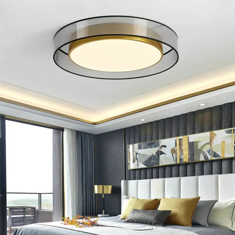 Modern black and gold led ceiling light with frosted glass center and sleek circular design for living room use