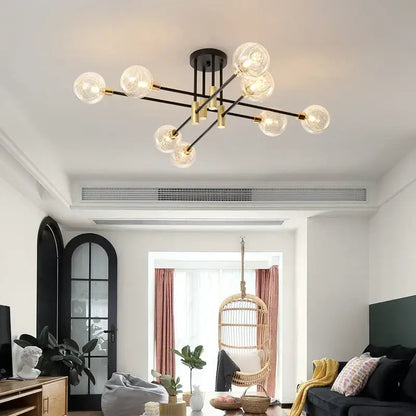 Modern black and gold led chandelier with multiple clear glass globe bulbs for living room decorbites black design