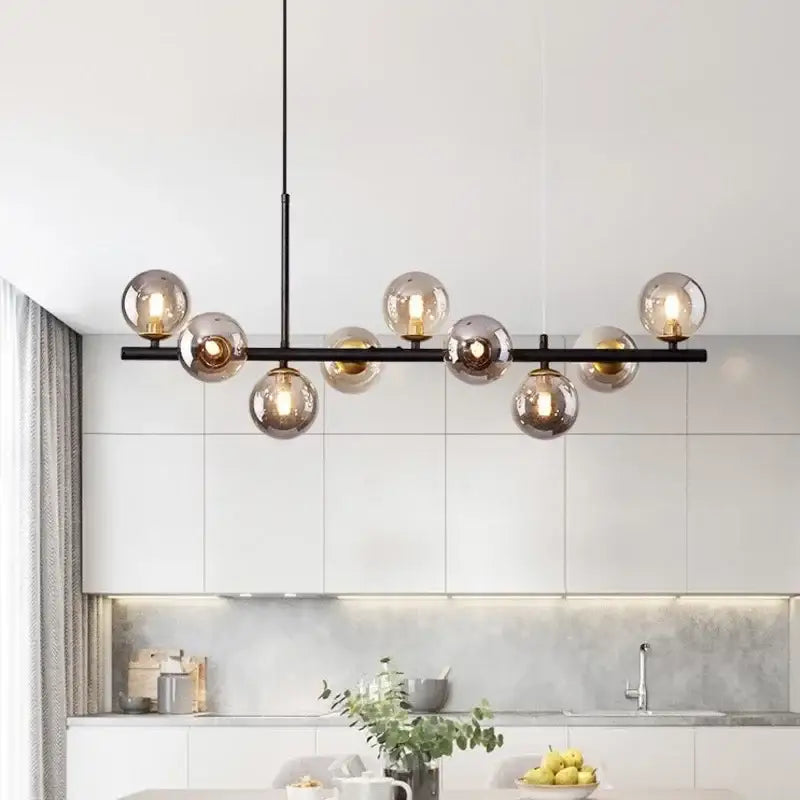 Modern black led pendant chandelier with amber glass globe bulbs in black and gold for living room lighting