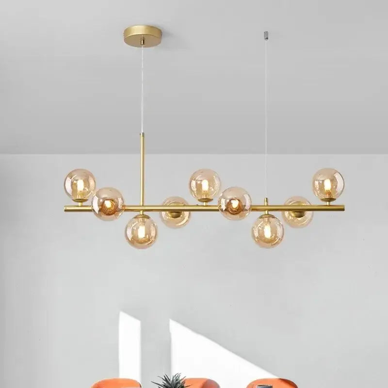 Modern black and gold led pendant chandelier with gold-toned amber glass globes for living room lighting