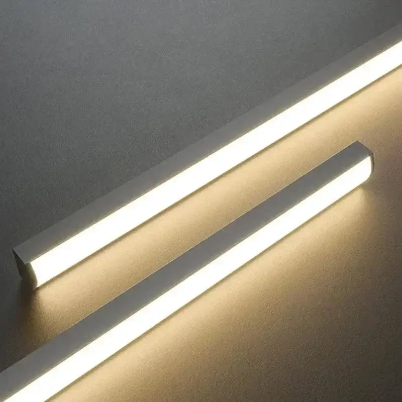 Two sleek modern led pendant lights with clean white finish and warm glow for minimalist dining room design