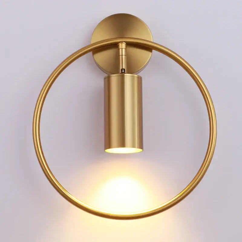 Modern black and gold led wall lamp with gold-finished circular sconce and cylindrical light fixture for living room