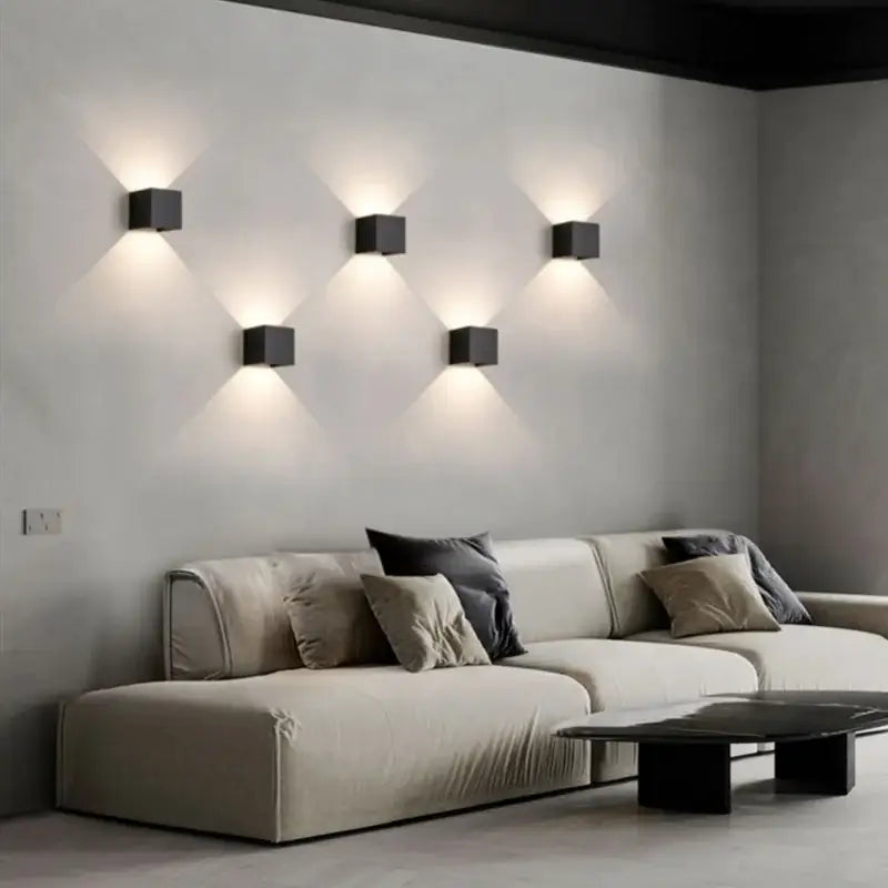 Six sleek black cube-shaped led wall lamps illuminate a minimalist living room modern decorbites led wall lamp design