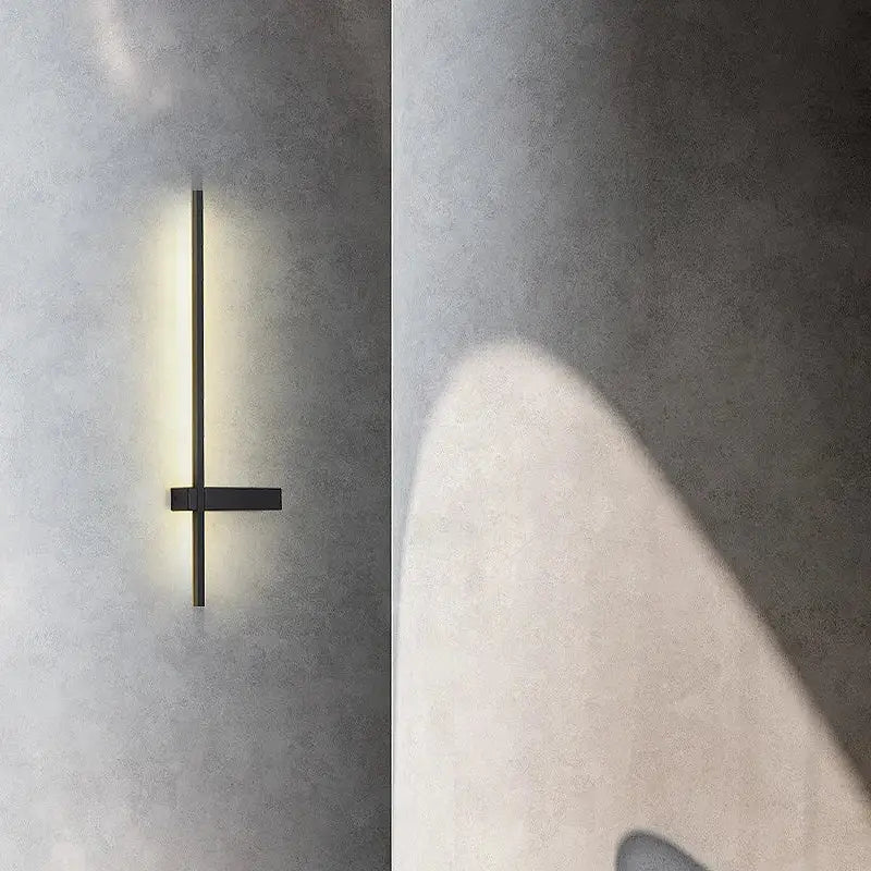 Modern black and gold led wall lamp minimalist wall sconce with sleek vertical bar emitting warm ambient light