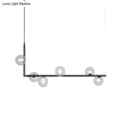 Modern black gold linear chandelier with clear glass globe bulbs ideal for dining room or island lighting
