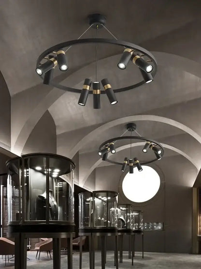 Modern black metal circle pendant light with gold-accented cylindrical spotlights for kitchen decorbites decor