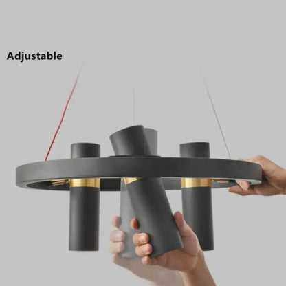 Modern black and gold metal circle pendant light with adjustable cylindrical arms for kitchen decorbites black metal decor