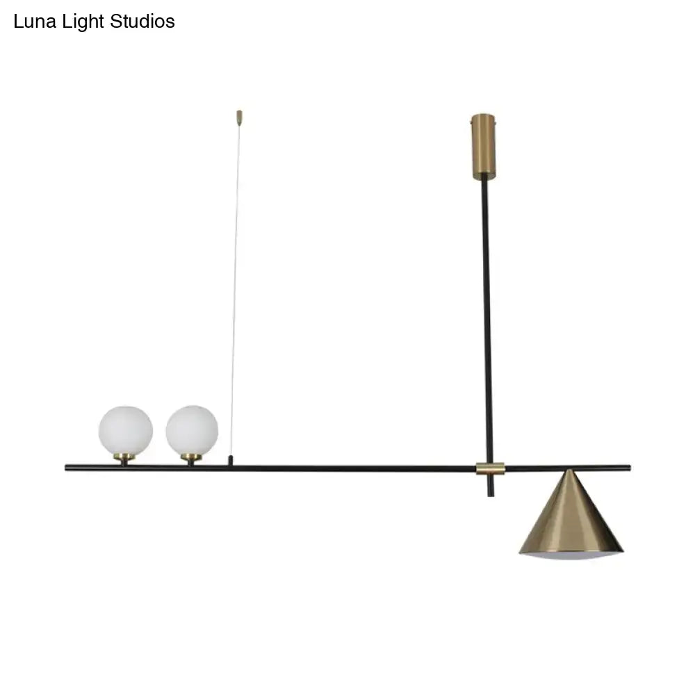 Modern black and gold metal cone island light with frosted glass globes and brass shade for dining room illumination