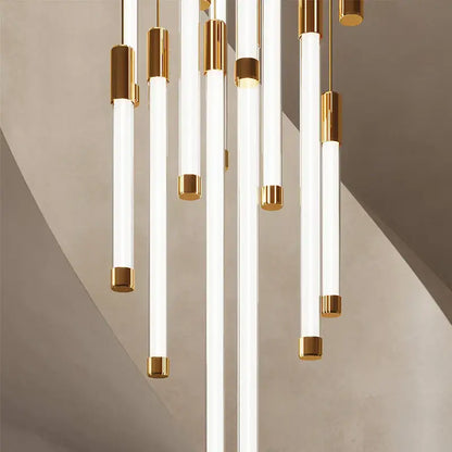 Modern black and gold pendant chandelier featuring sleek white cylindrical glass tube pendant lights for staircase light sources