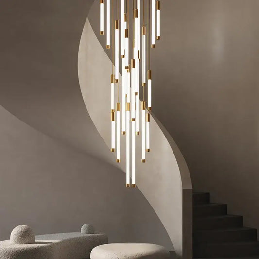 Modern black and gold pendant chandelier with slender white cylindrical tubes and cascading light sources for staircases